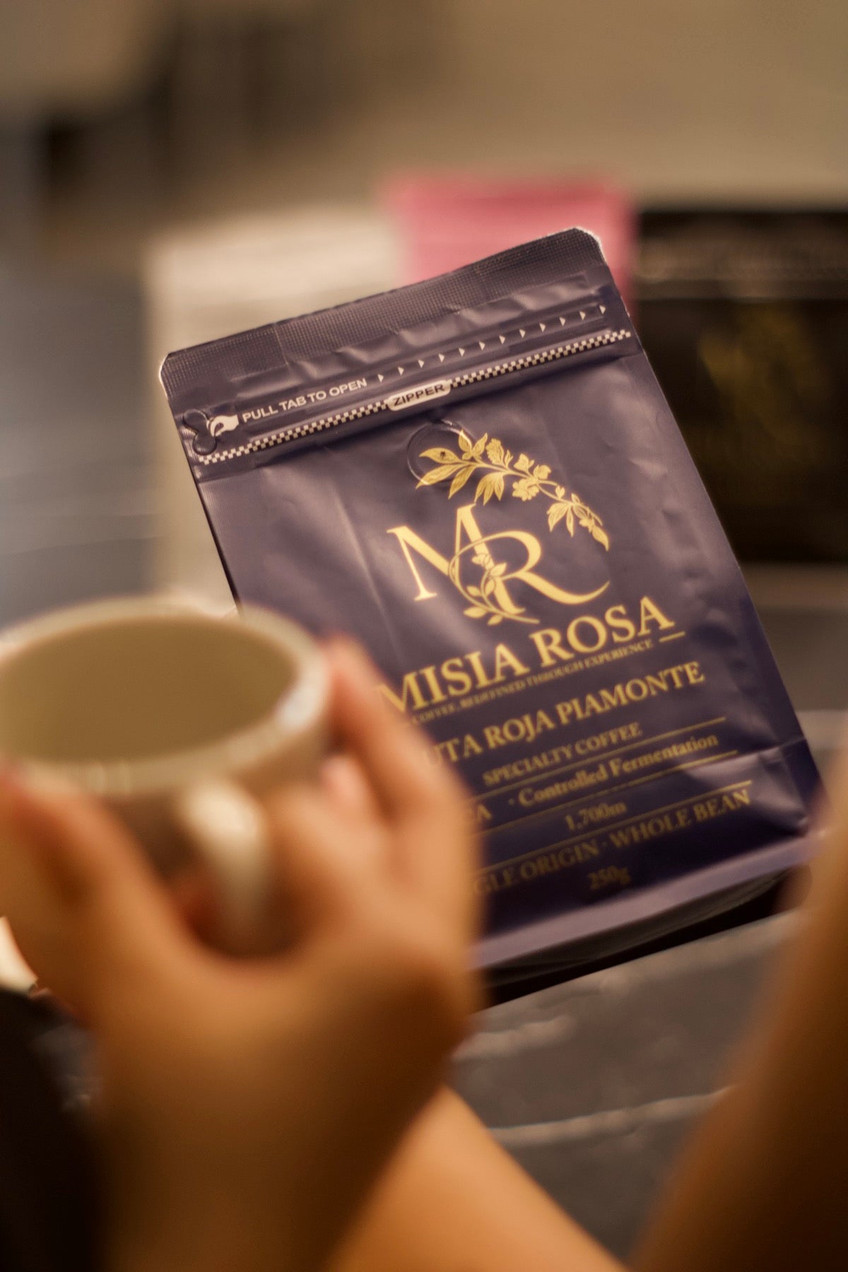 A Misia Rosa bag with an empty cup ready to brew