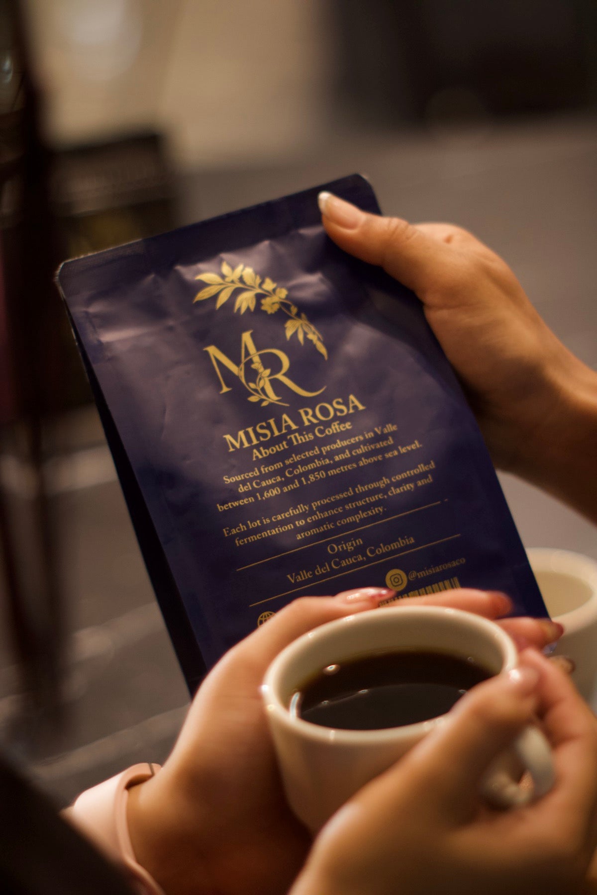 A finished cup of Misia Rosa coffee in hand
